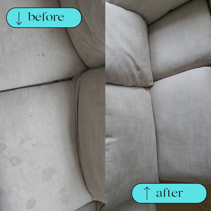 Beige sofa with visible stains on cushions.