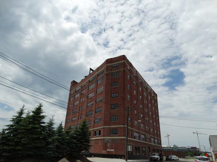 A large red brick building with a lot of windows.