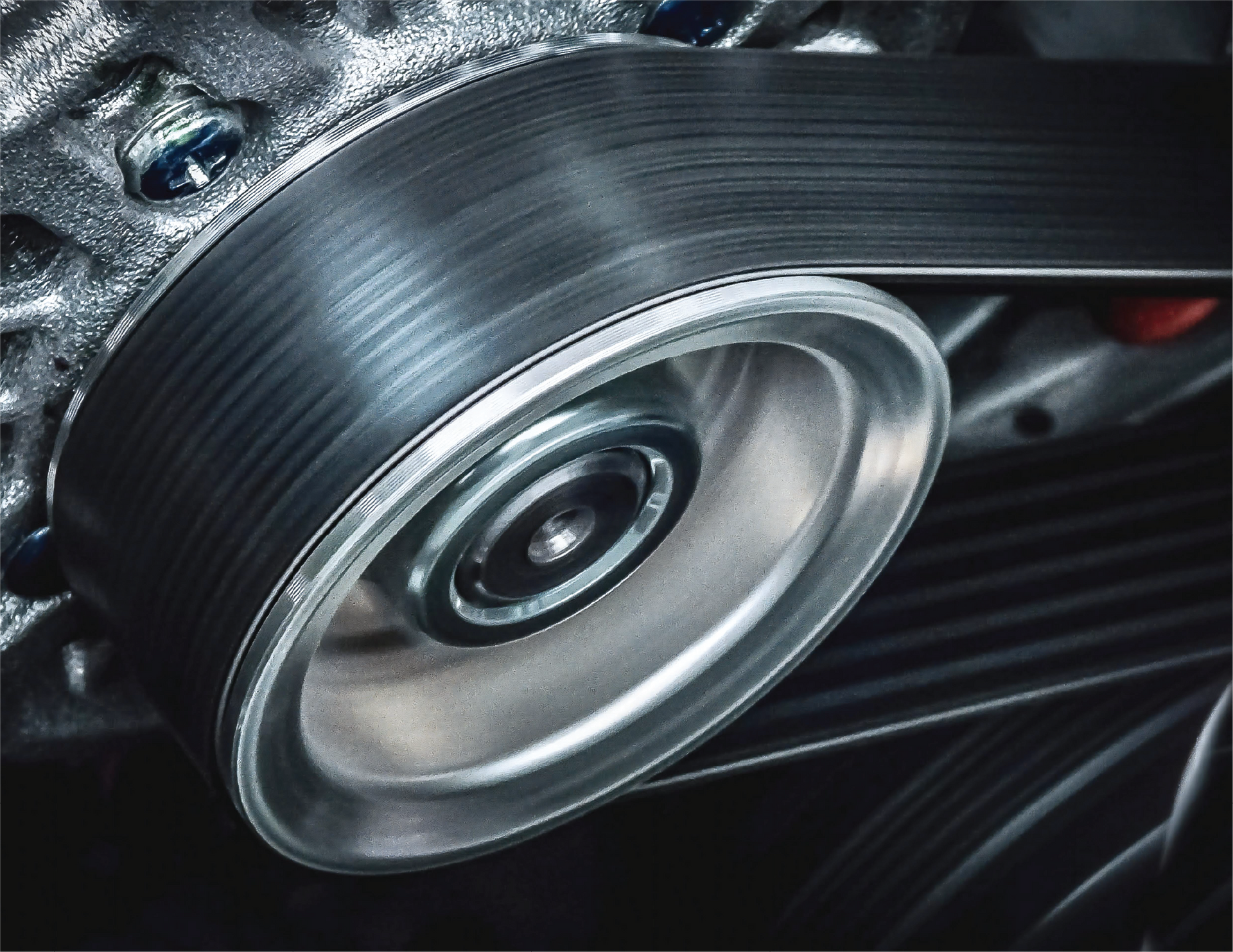 A man wearing gloves is working on a clutch disc