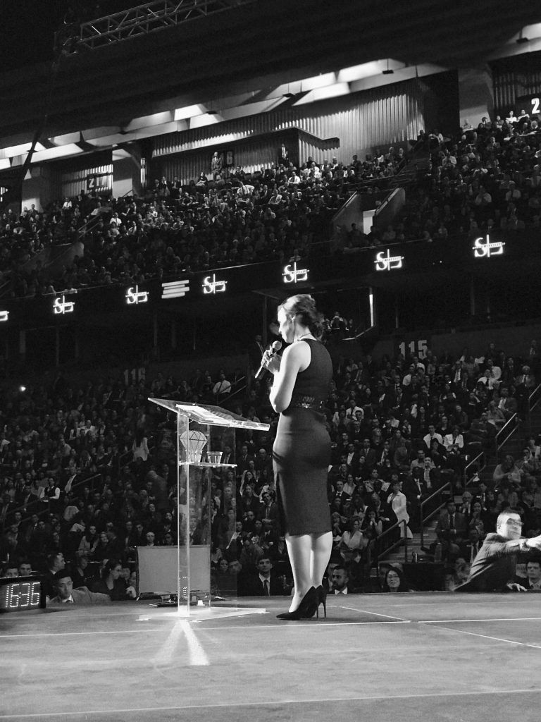 Ann Speaking on-stage in black & white