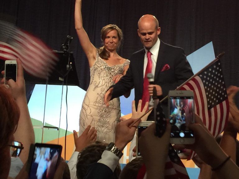 Ann & Tye Rustrum with the American Flag