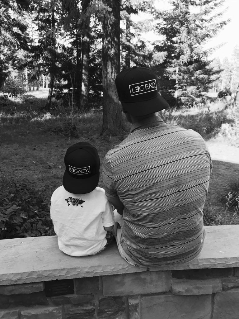 Tye Rustrum with his son from the back