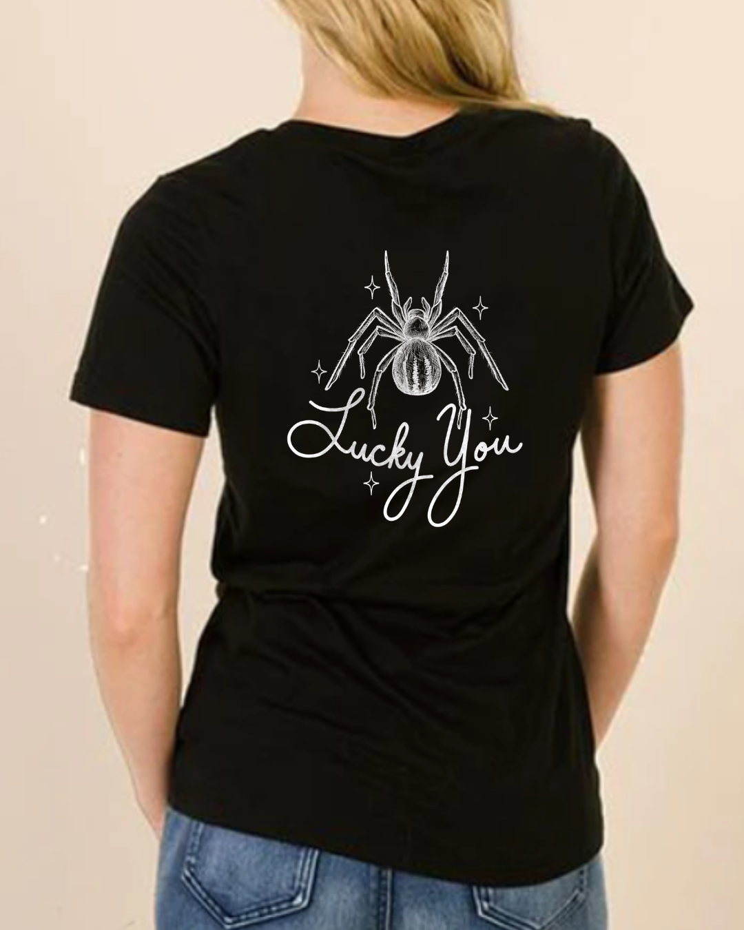 Lucky You black unisex t-shirt with white spider graphic and lettering printed on the back, 50% cotton 50% polyester blend