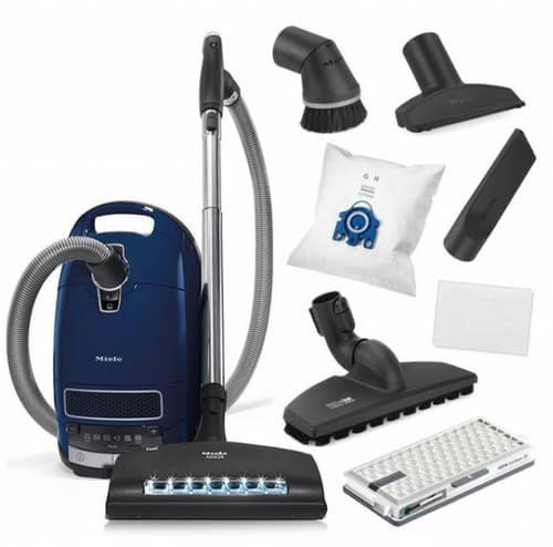Blue Miele vacuum cleaner with attachments and accessories.