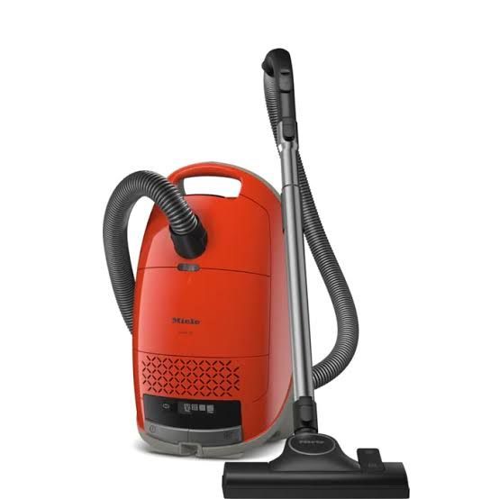 a black vacuum cleaner with a hose attached to it | Sewing Machine Repair — Orange County, California — Capistrano Vacuum & Sewing Center