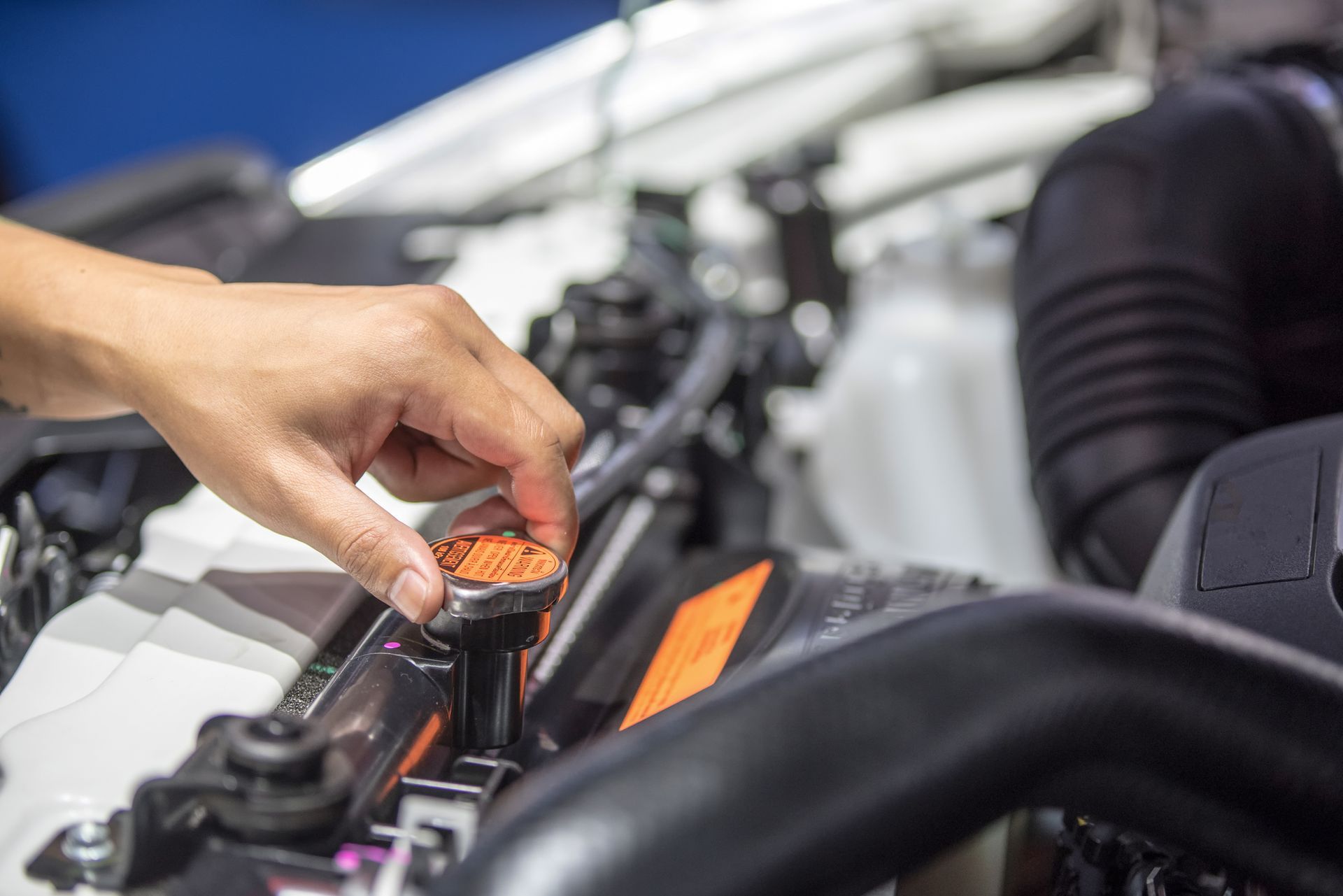 Hands of mechanic checking the car heat exchanger