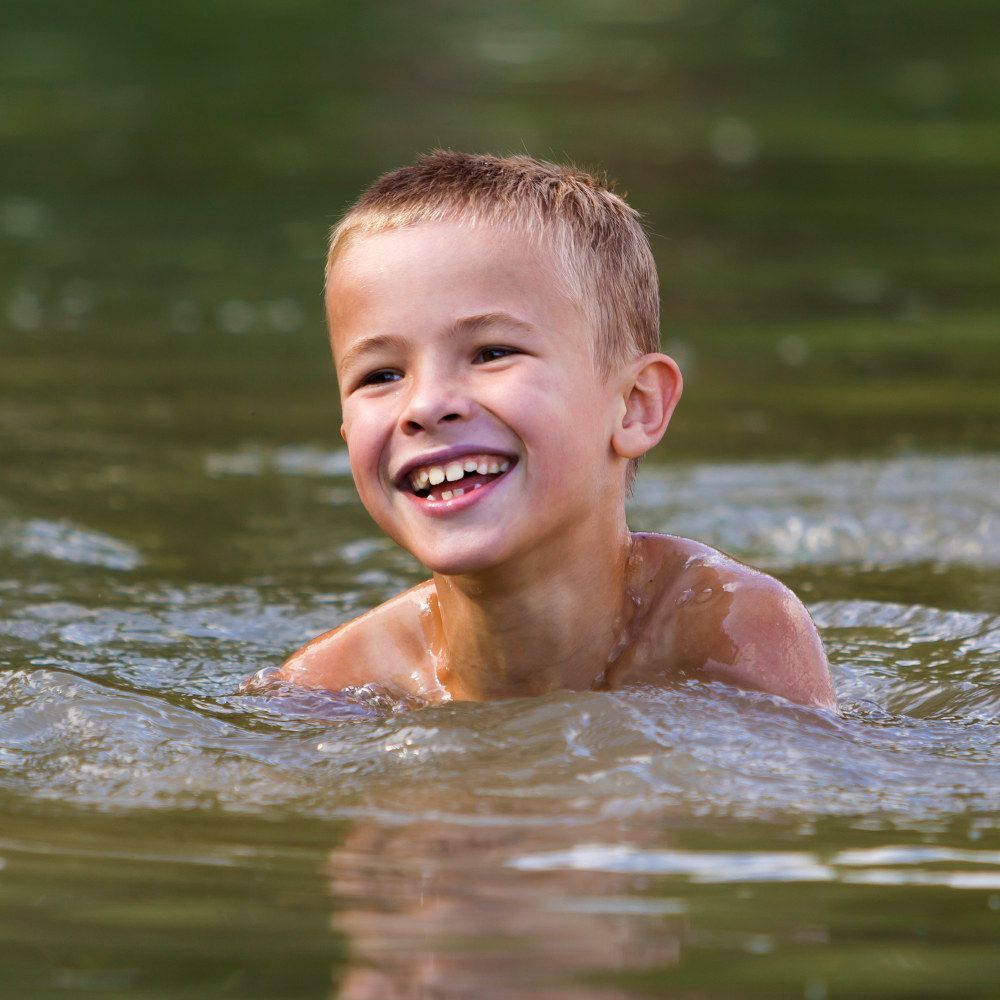 Things to do here - Boy Swimming in the Pond