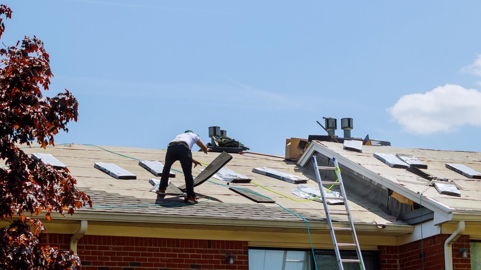 Roofing crew replacing a roof.