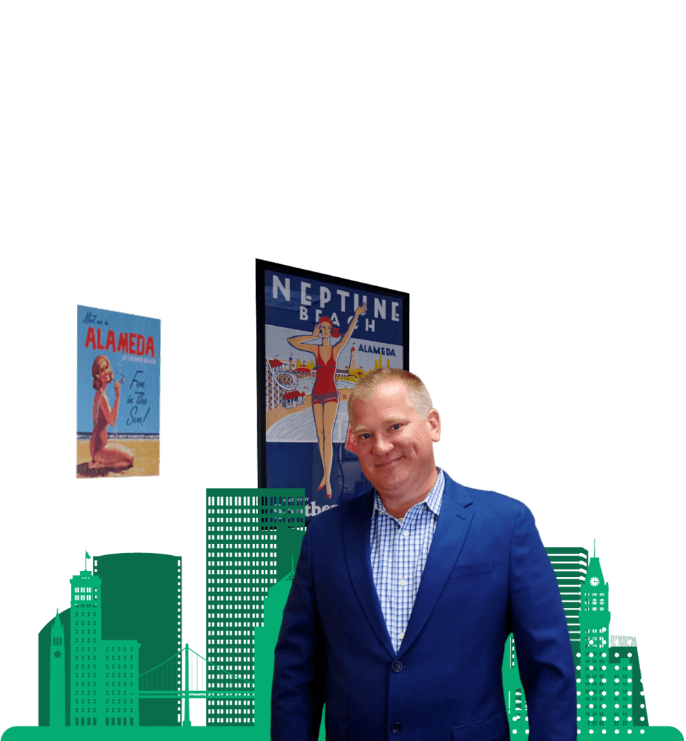 A man in a blue suit stands in front of a poster for neptune beach
