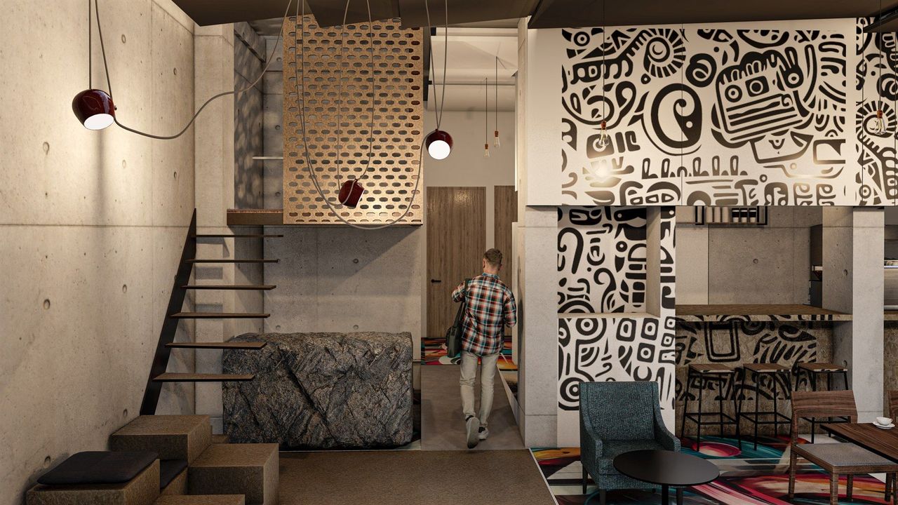 A man in a plaid shirt is walking through a living room