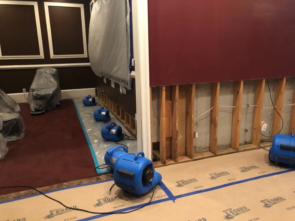 A room with a lot of appliances on the floor.