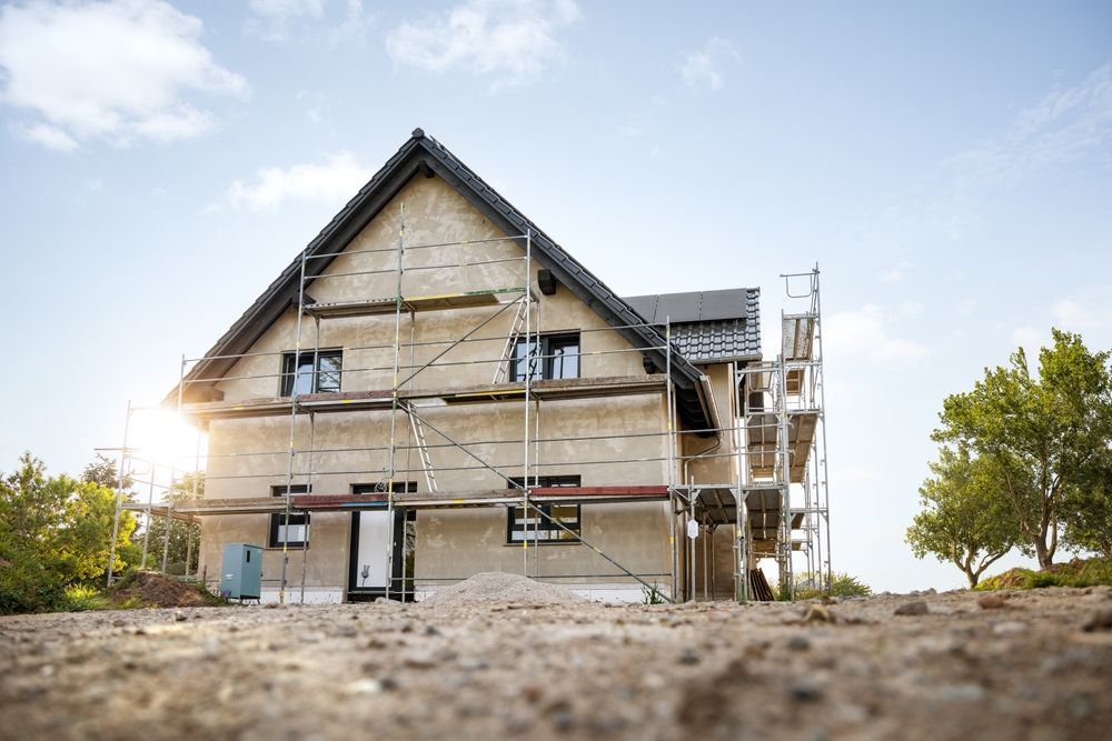 A house is being built with scaffolding around it.