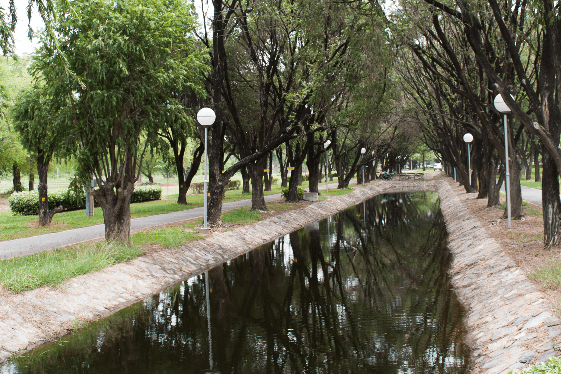 concrete swale next to walkway