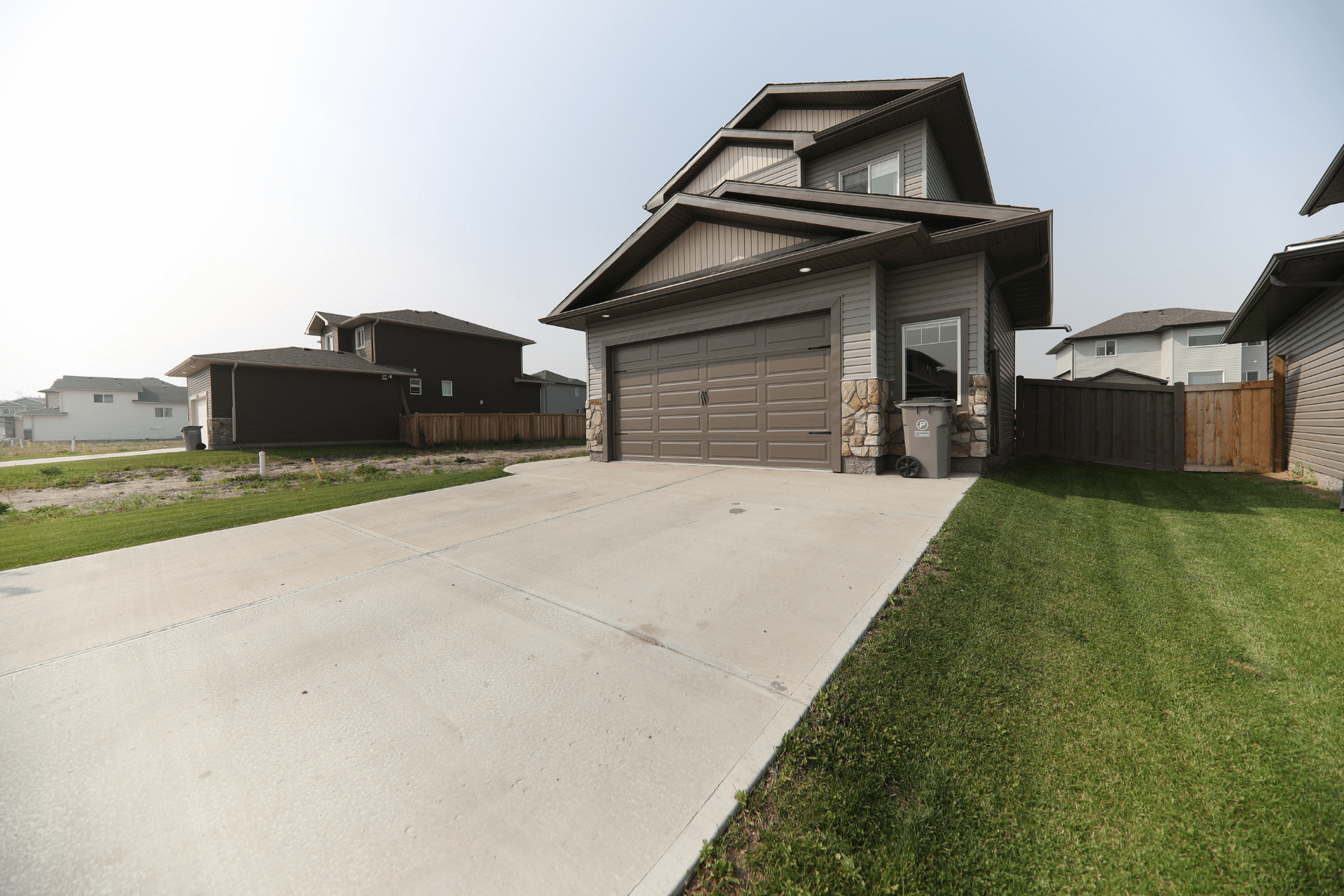 concrete driveway in front of the house