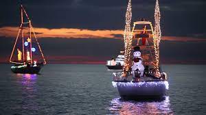 Boats decorated with Christmas lights at the boat parade in Biloxi, MS