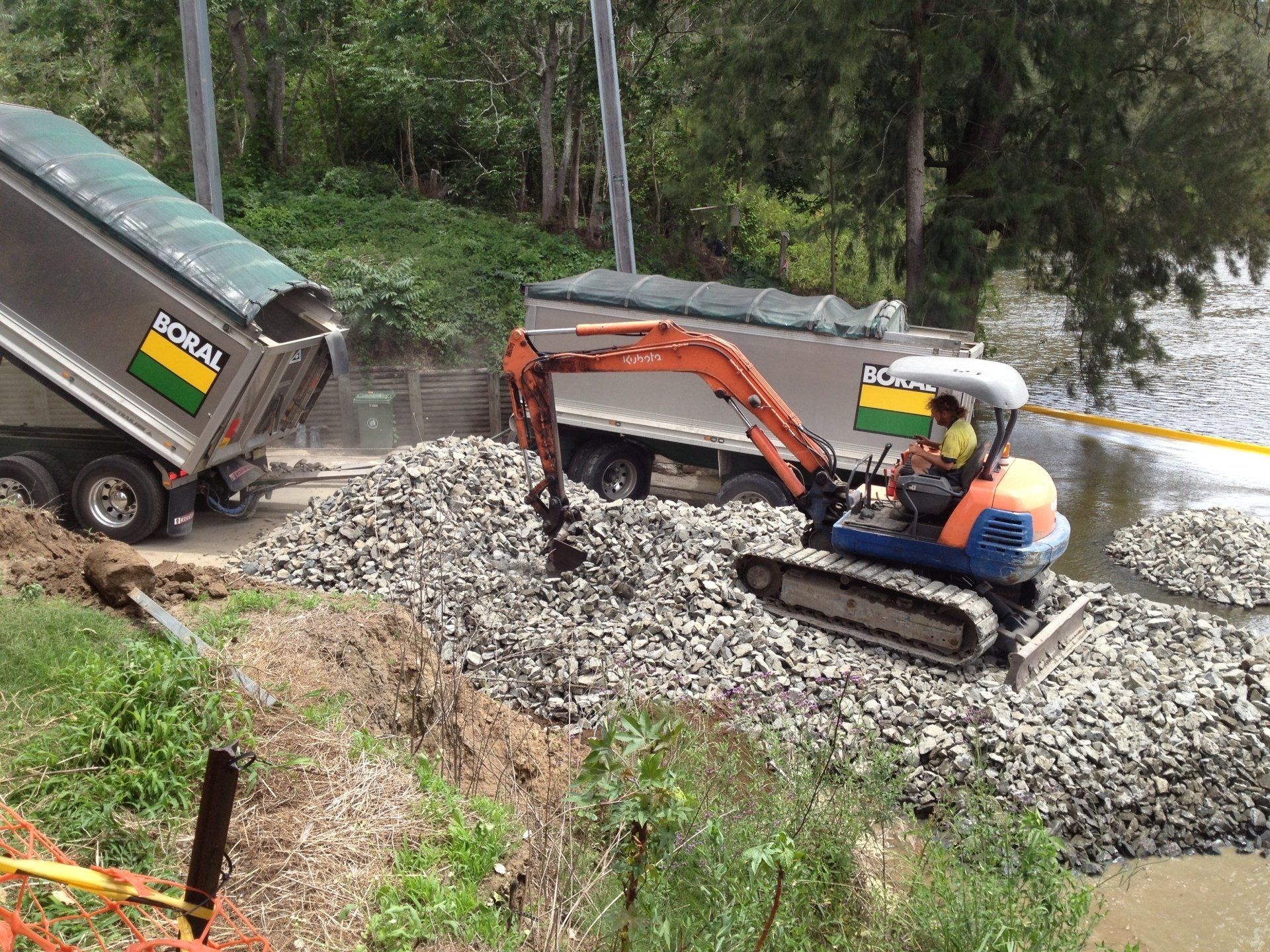 Digger moving stones