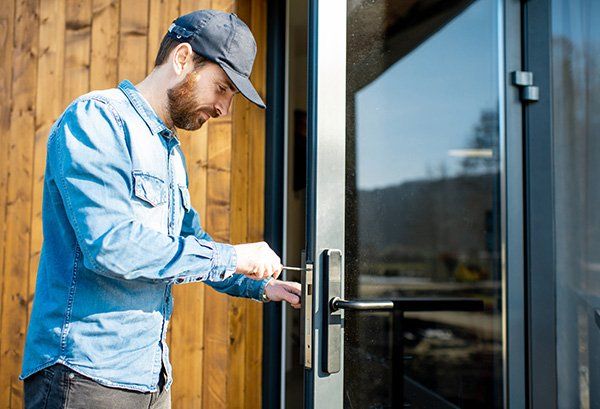 Man Repairing Door Lock — Oaklyn, NJ — Haddon Locksmith