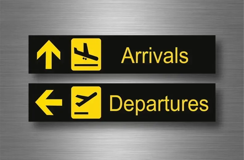 A sign that says arrivals and departures on it