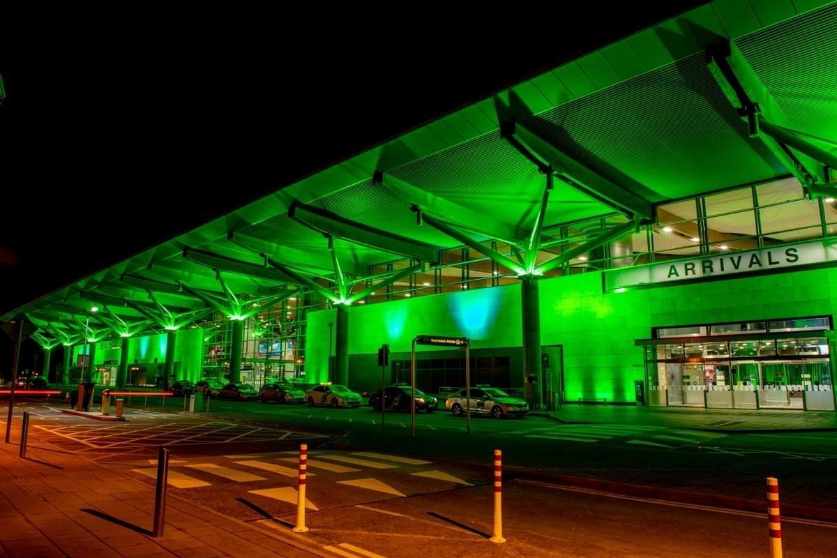 a green building with the word arrivals on it