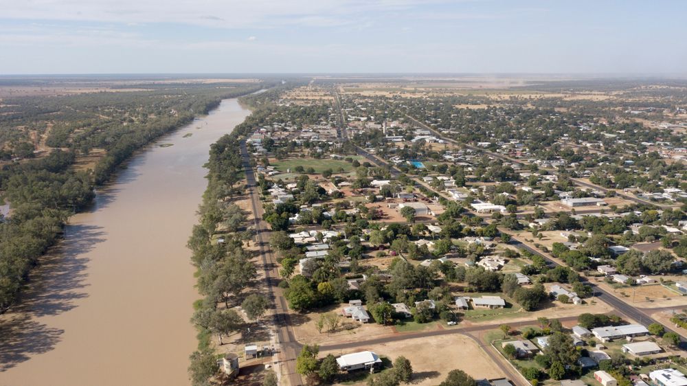 Aerial View of a Town Beside a Wide, Muddy River — FAW Electrical in St Georges Basin, NSW