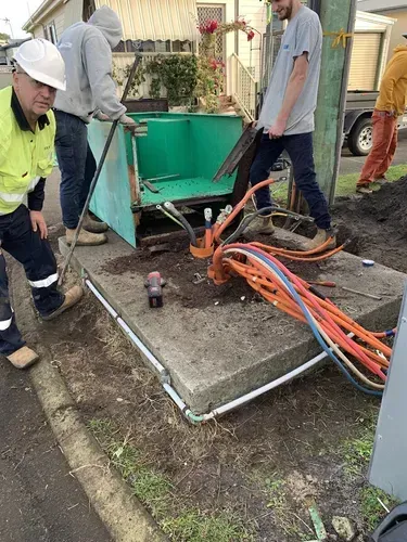 Workers Installing Cables at a Roadside Utility Box — FAW Electrical in Nowra Hill, NSW