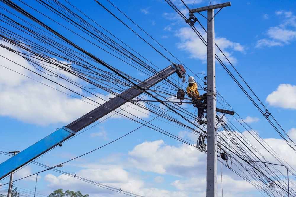Black Battery With Red and Blue Wires Connected to Red and Blue Switches — FAW Electrical in St Georges Basin, NSW