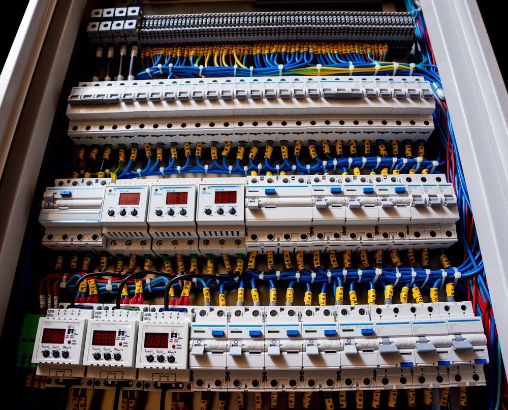 Electrical Panel With Rows of Circuit Breakers and Wiring — FAW Electrical in St Georges Basin, NSW