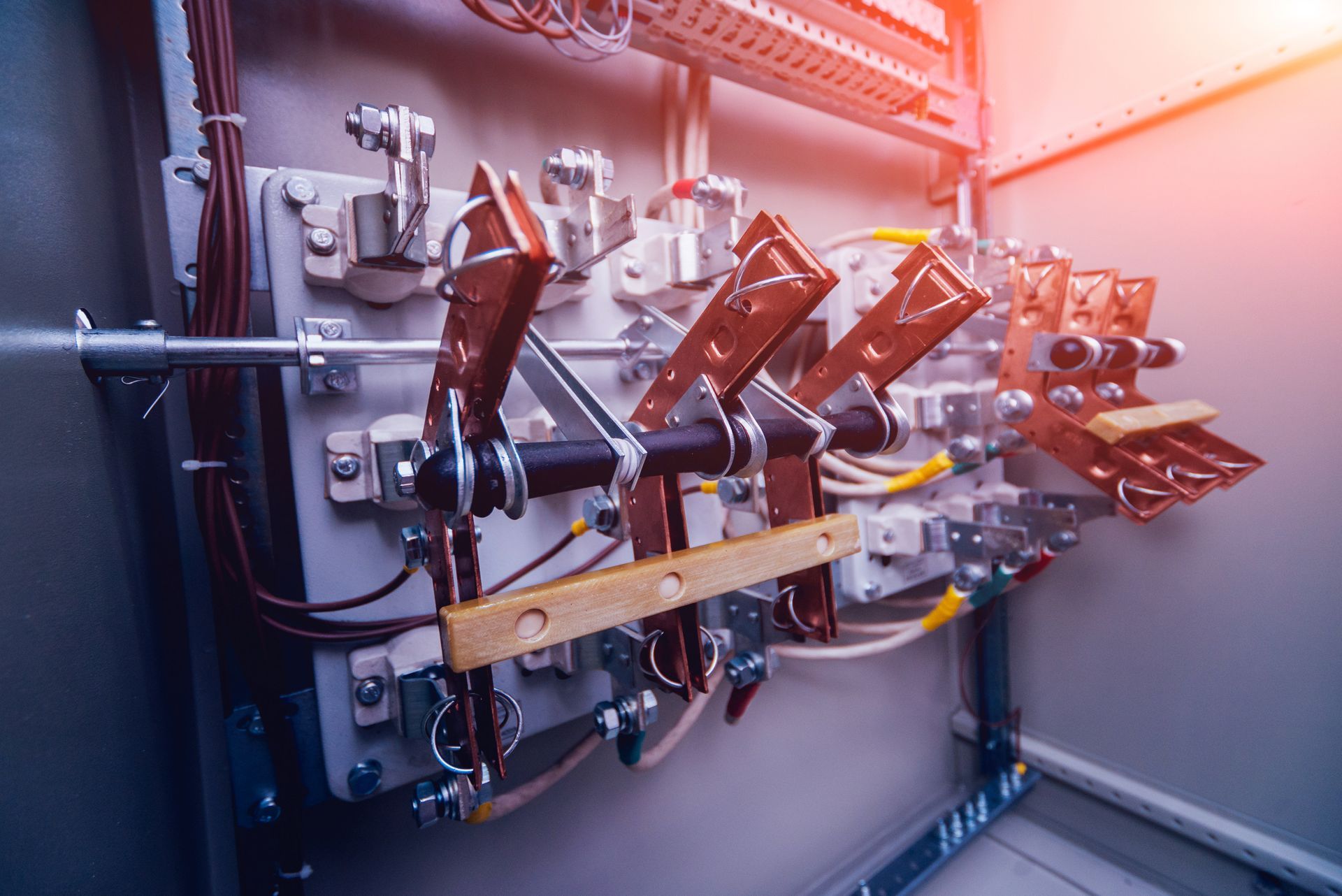 Electrical Panel With Copper Contacts, Wires, and Switches Inside a Metal Cabinet — FAW Electrical in Nowra Hill, NSW