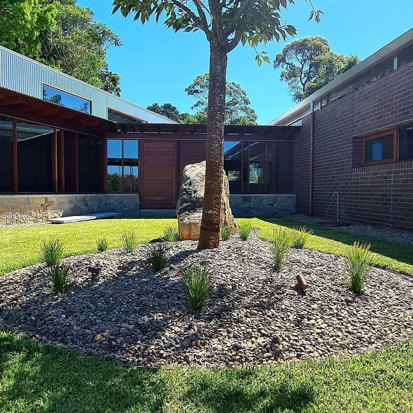 Exterior of a Modern Home With a Tree in the Foreground — FAW Electrical in Nowra Hill, NSW