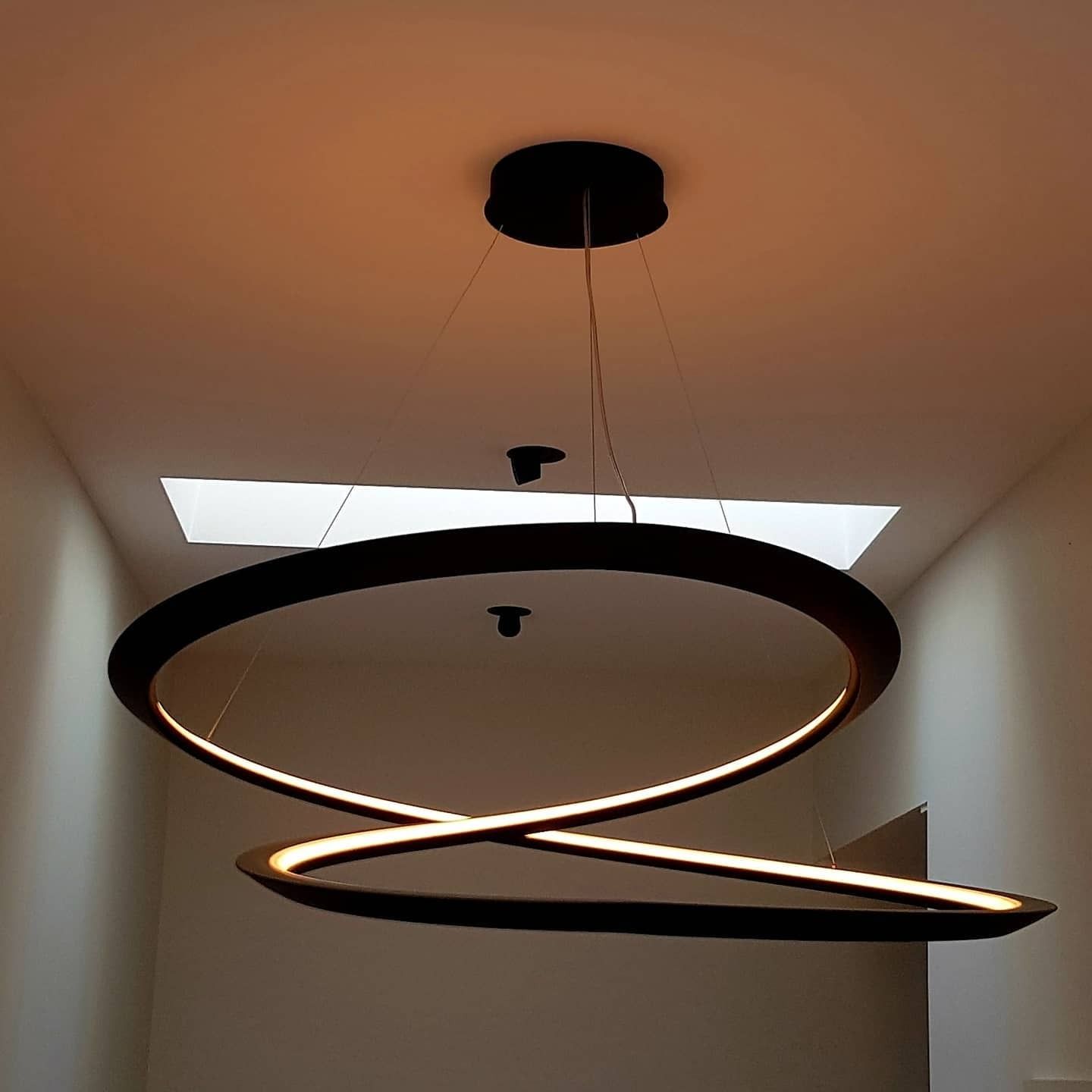Black, Modern Chandelier With Two Illuminated Rings — FAW Electrical in Nowra Hill, NSW
