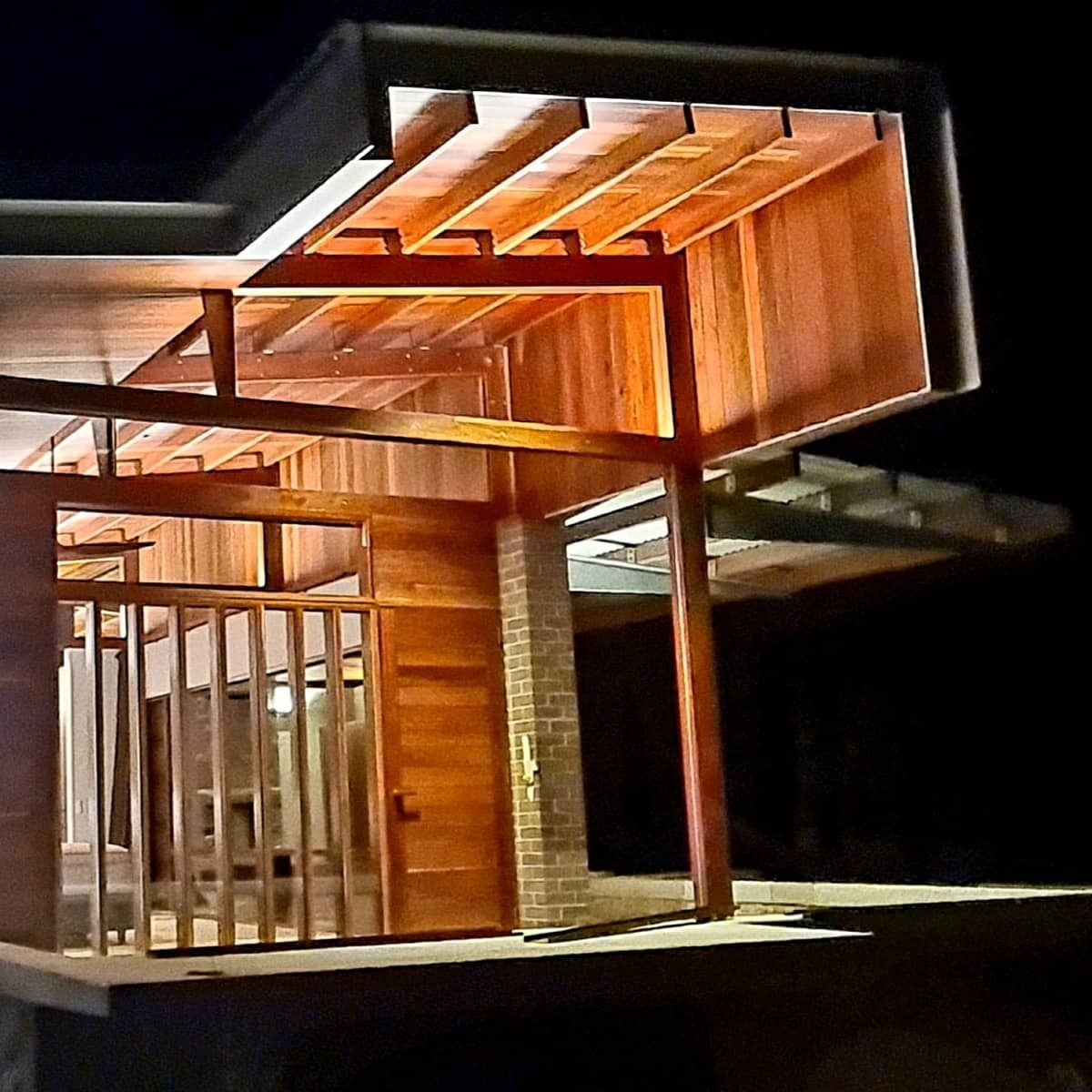Wooden Architectural Structure Lit at Night — FAW Electrical in Nowra Hill, NSW