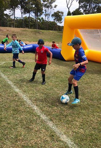Juniors Playing Football — Football Clubs in Kingscliff, NSW