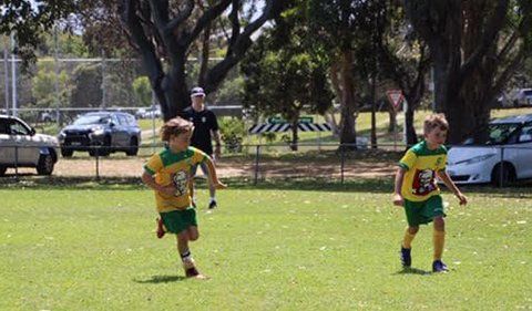 Young Boys Playing Football — Football Clubs in Kingscliff, NSW Young Boys Playing Football — Football Clubs in Kingscliff, NSW