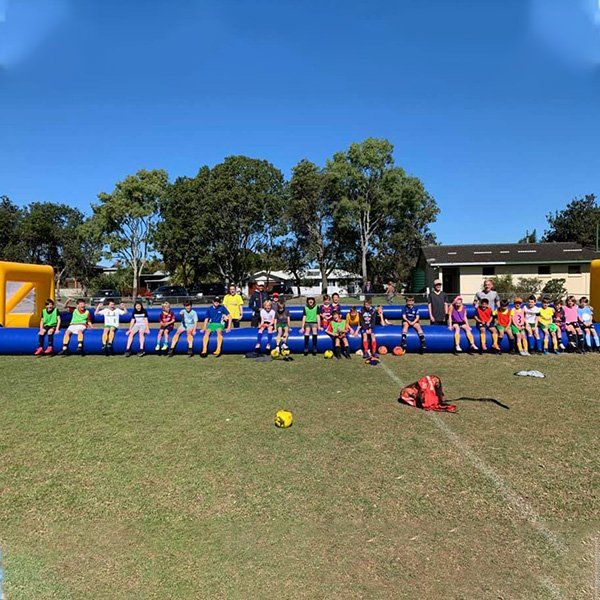 Football Players Inside The Field — Football Clubs in Kingscliff, NSW