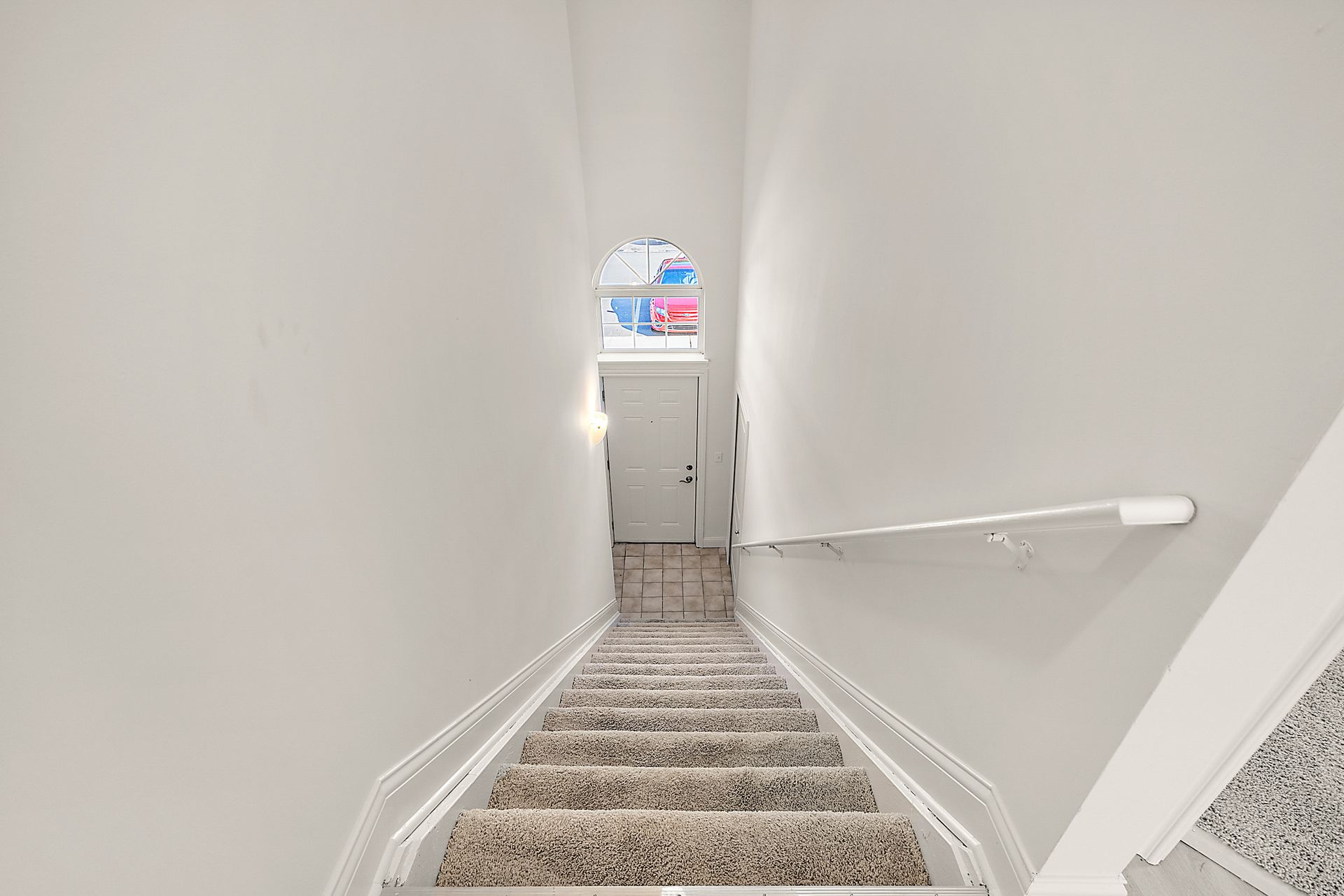 A set of stairs leading up to the second floor of a house.