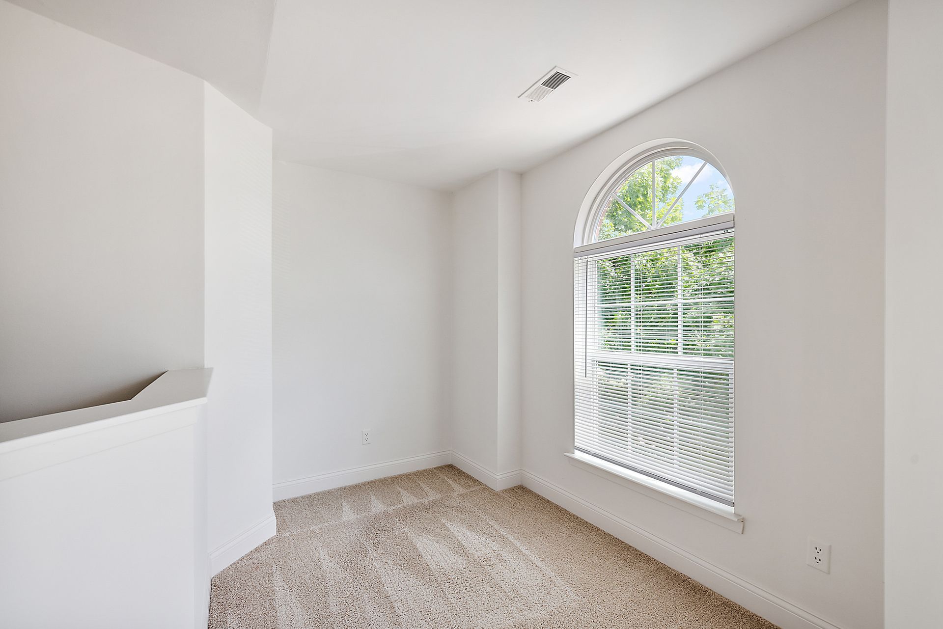 There is a large window in the middle of the room.