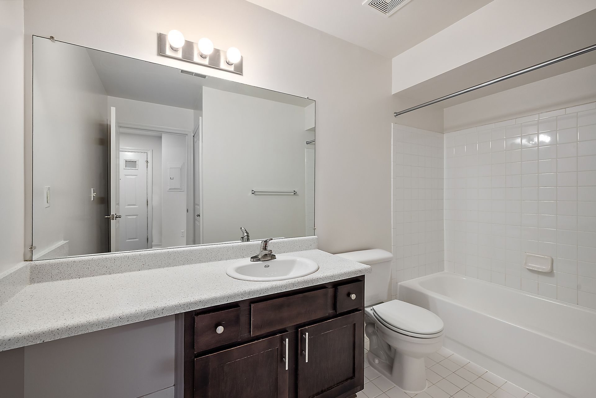 A bathroom with a sink , toilet and bathtub