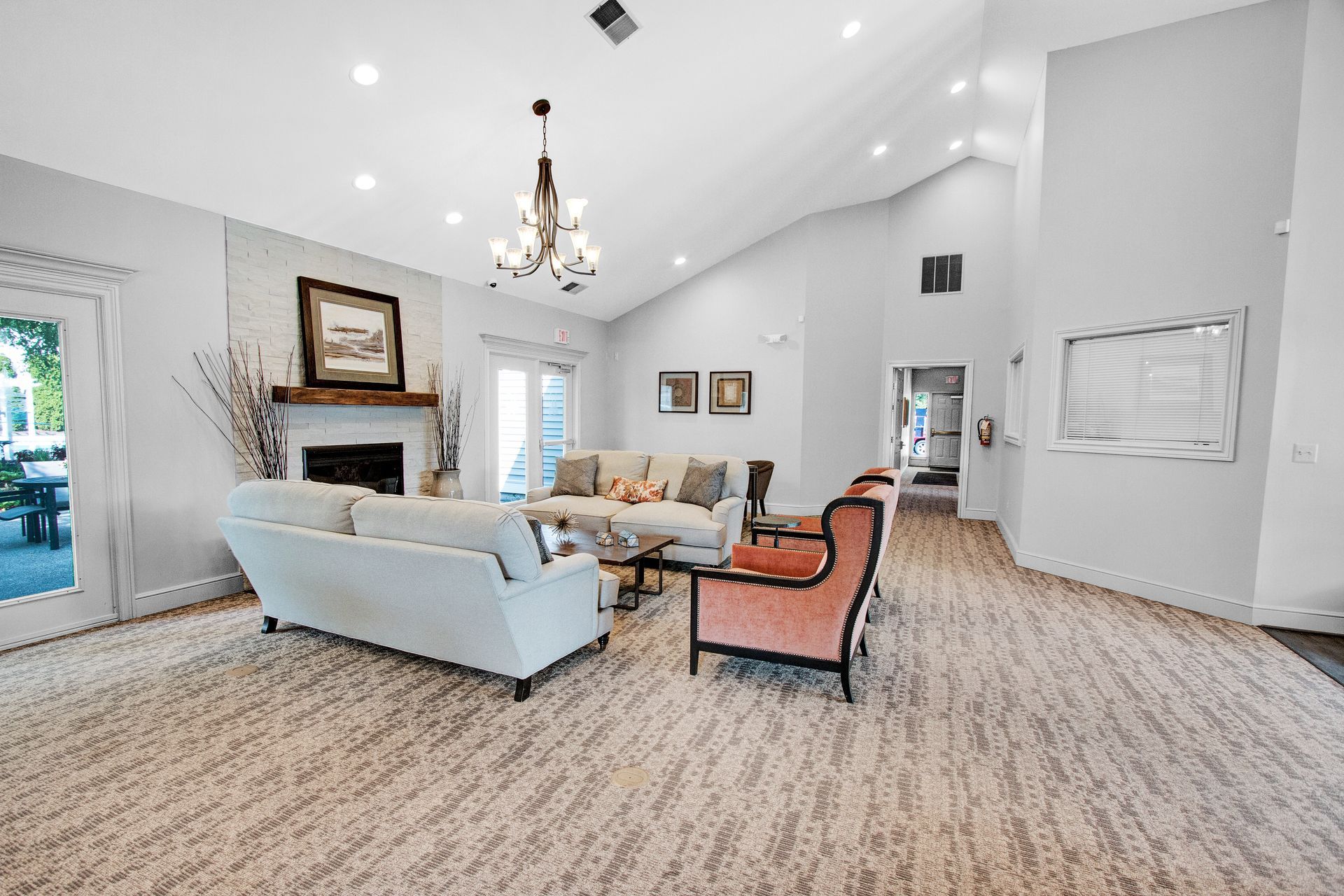 A living room filled with furniture and a fireplace.