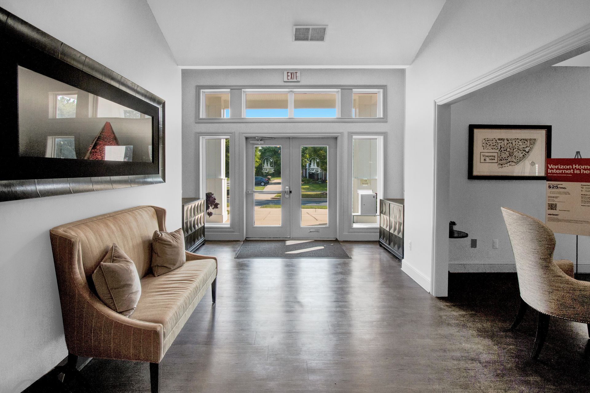 A living room with a couch and chairs in it