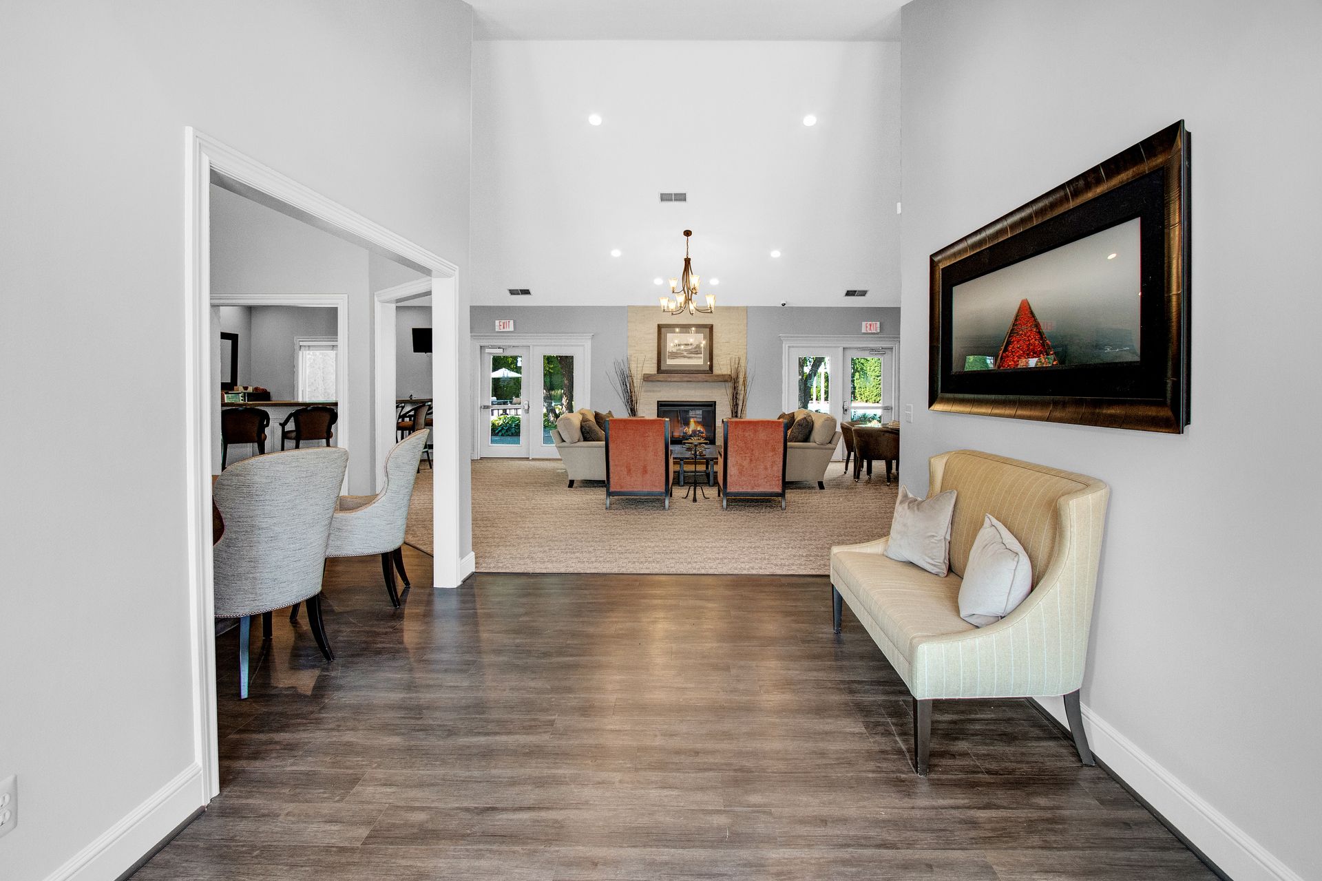 A living room with a couch , chairs , and a fireplace.