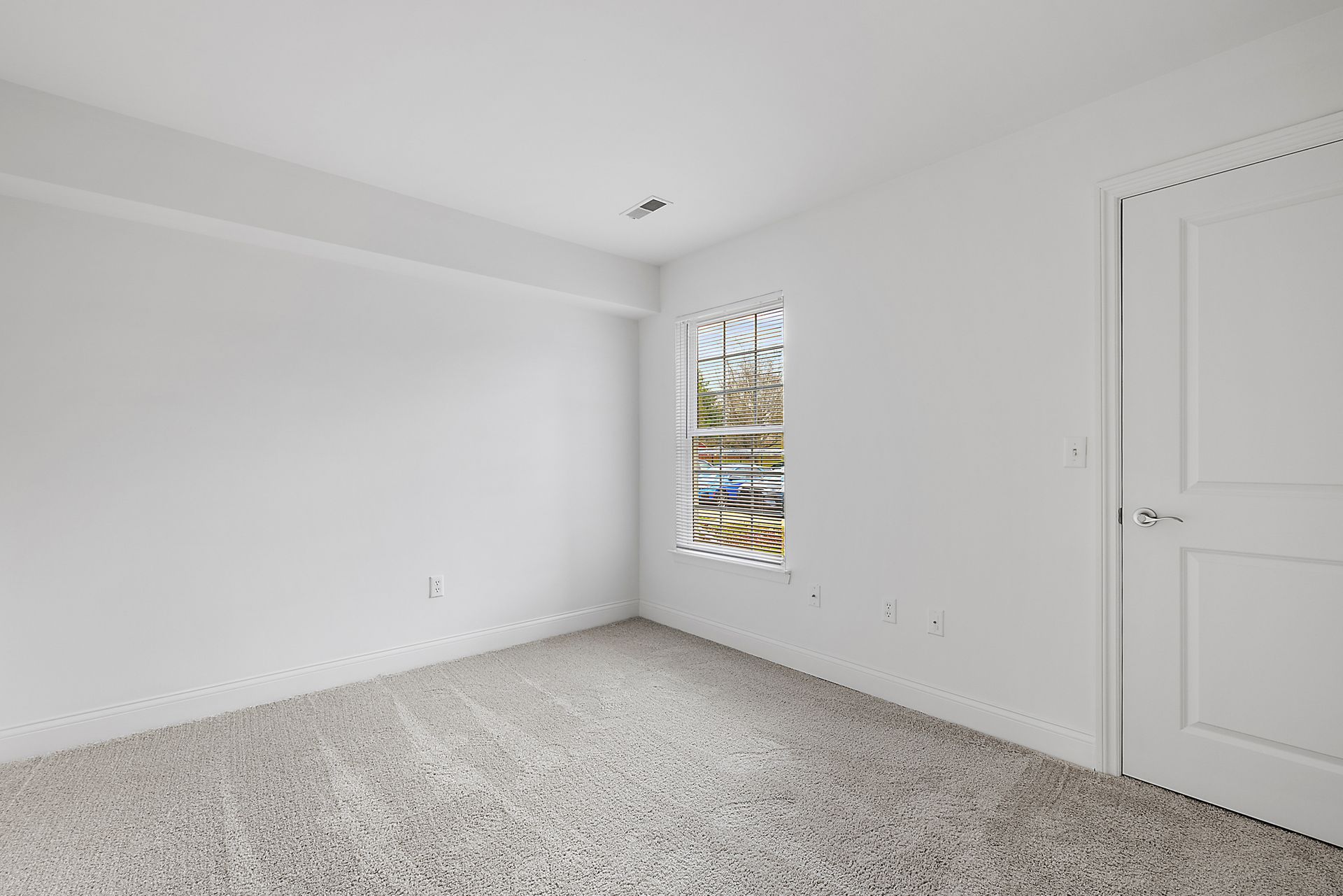 There is a window in the corner of the room.