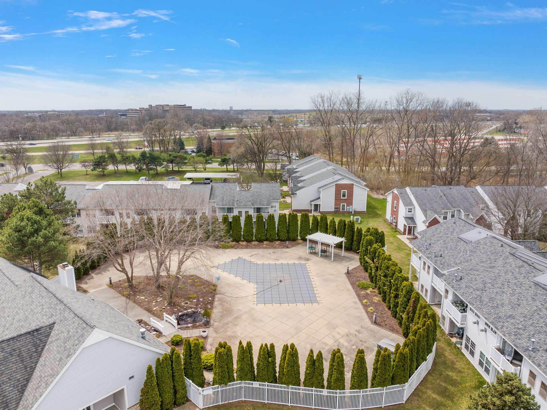 An aerial view of a residential area with lots of houses and trees.