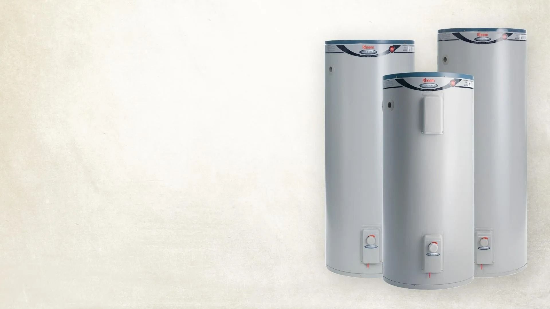 Three Tall Cylindrical Water Heaters Against Light Background — David Talbot Plumbing in Cranbrook, QLD