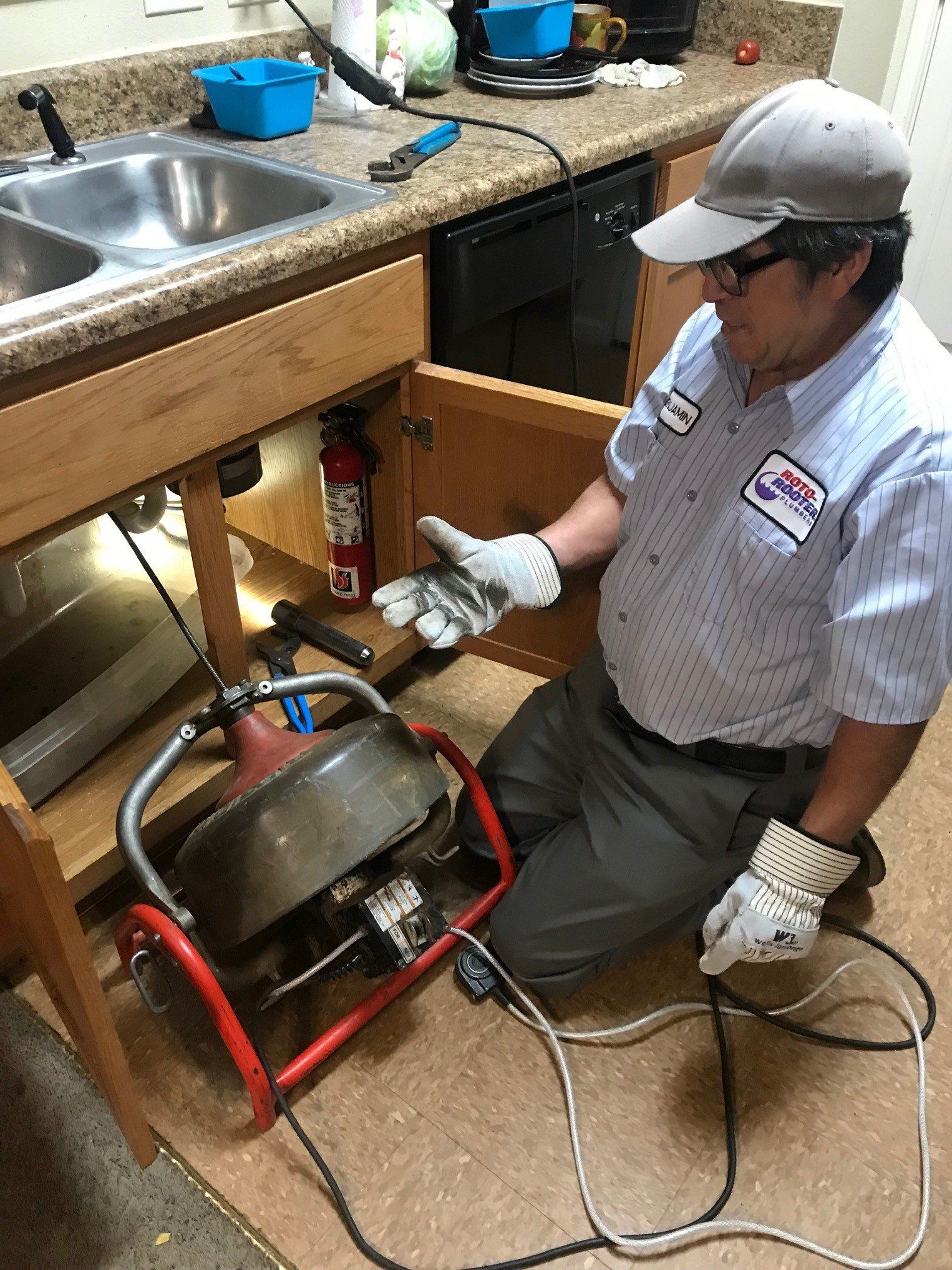 Commercial Plumbing — Smiling Repairman in Hot Springs, AR