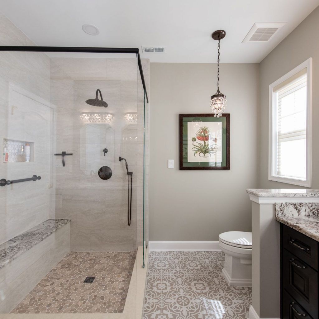 a bathroom with a walk in shower and a toilet
