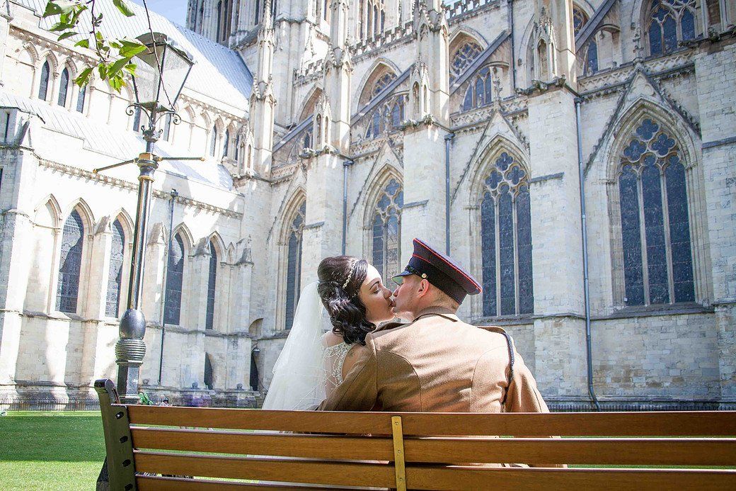 wedding kiss beside church