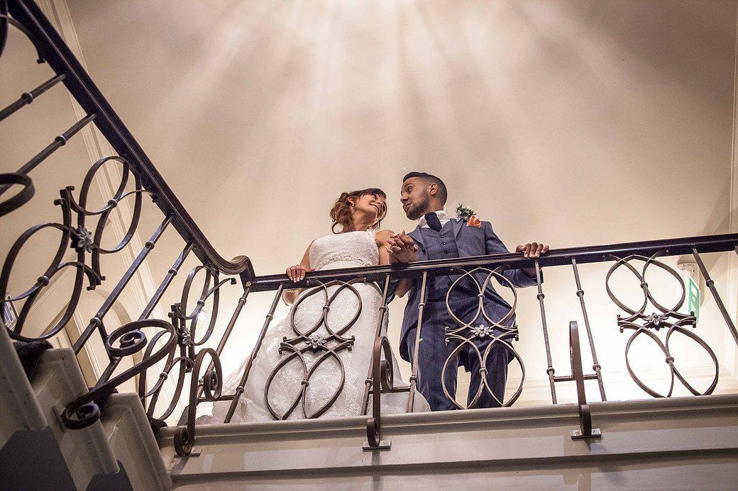 a married couple by the railing