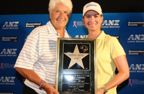 Women are holding trophy