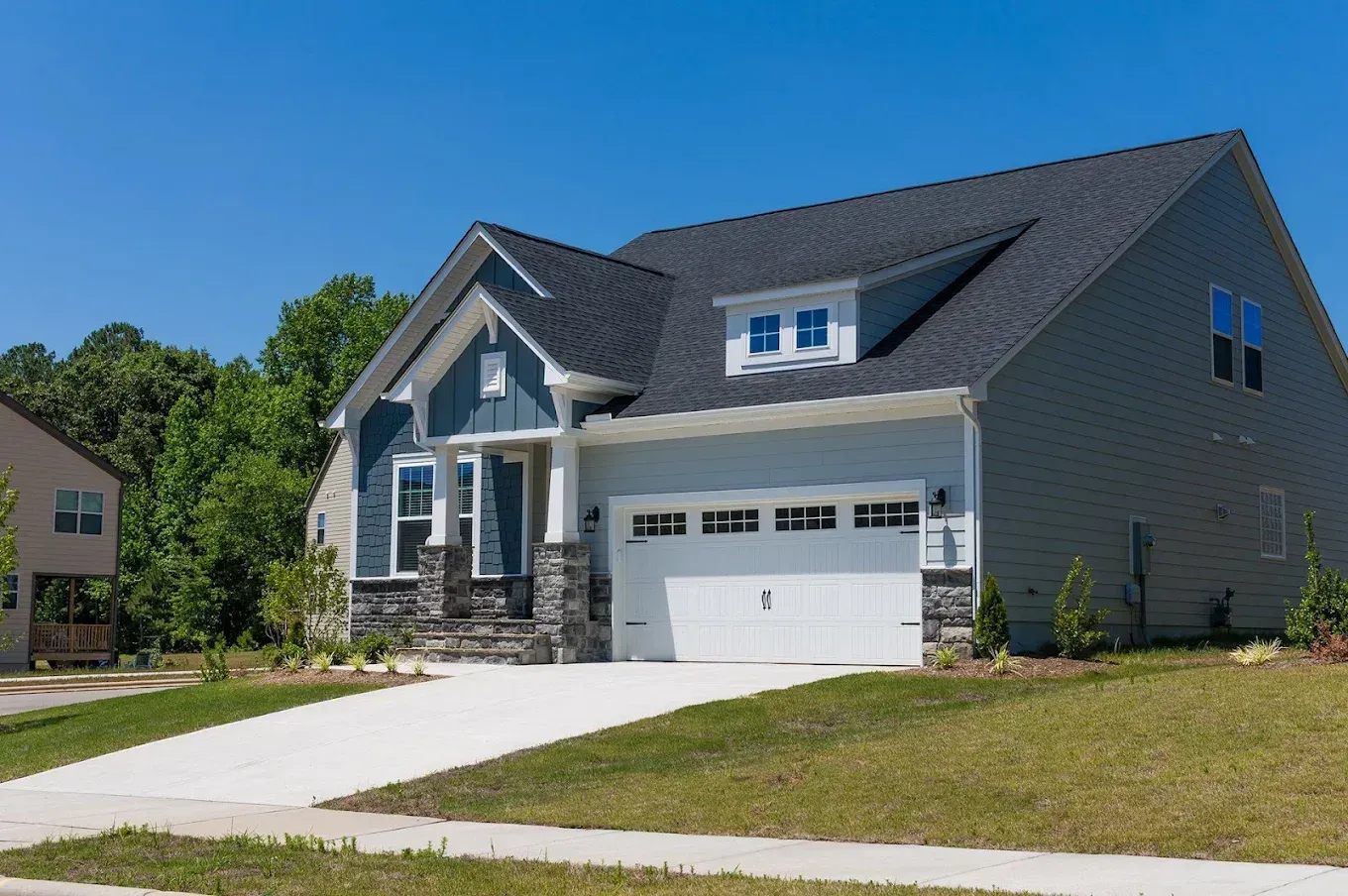 A large house under construction with a blue sky in the background.