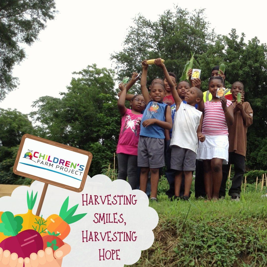 A group of children holding harvested vegetables in an outdoor garden with the text 